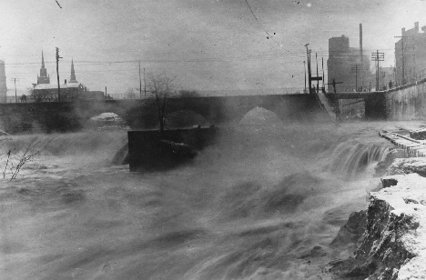 Downtown Kent during the height of the 1913 flood. Kent dam is visible at left of photo, and the railroad is submerged to the right. Photo  from the A.J.  Trory Collection, KSU Special Collections