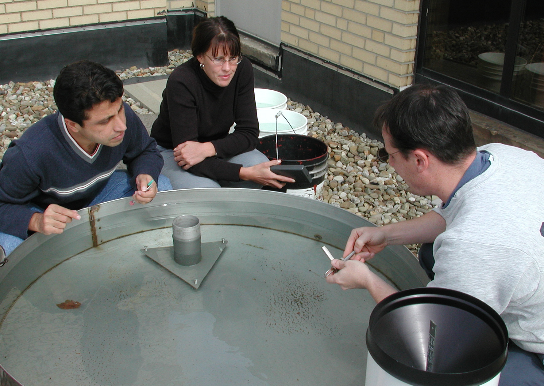 Andy demonstrates Kent's Class A pan to Muhammad Asim and Tamie Jovanelly