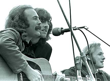 Photo of Crosby, Stills, and Nash performing live on stage.
