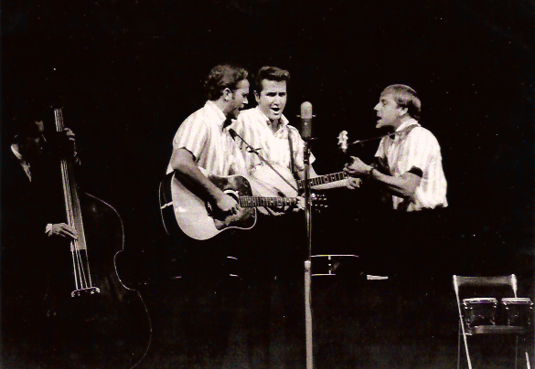 Kingston Trio performing live on stage.