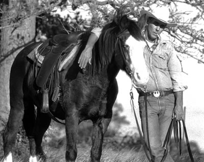 black and white photo print of a horse and a cowboy