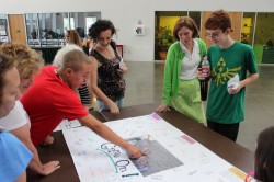 Students gather around drawing
