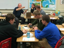 Students gather around drawing