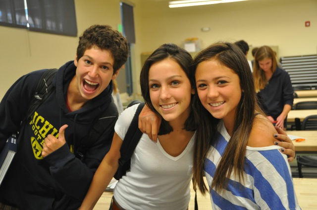 Students gather around drawing