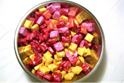 Title: starburst - Description: a picture of wrapped starburst in a metal bowl