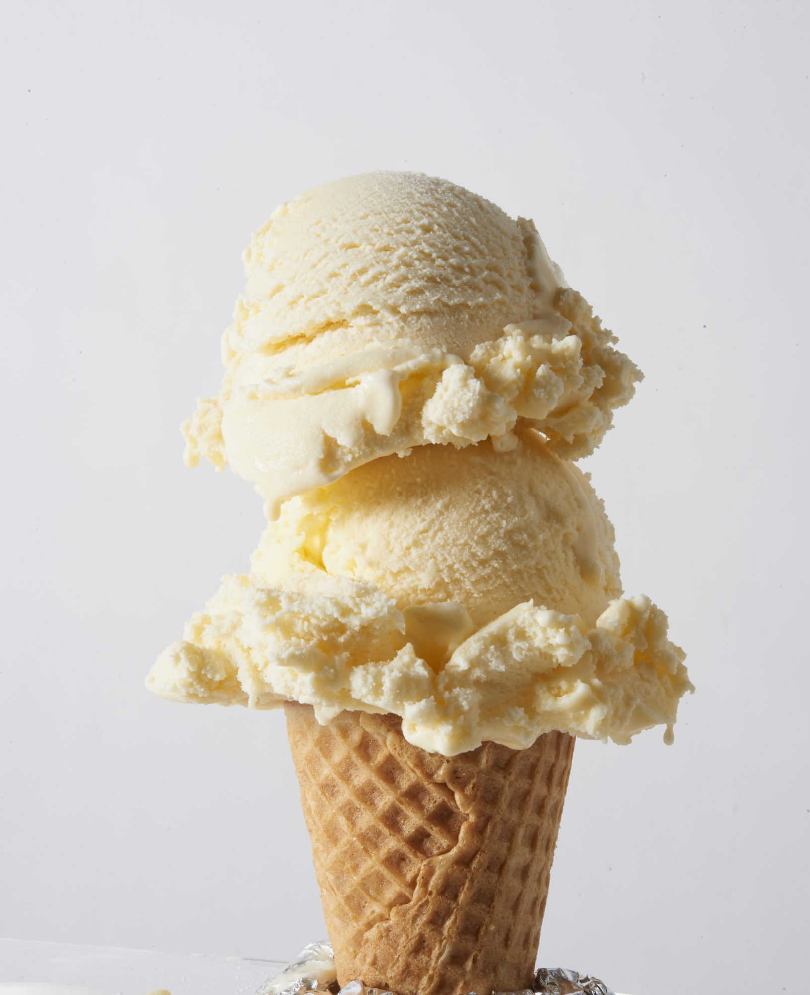 Image of two vanilla ice cream scoops on top of each other.